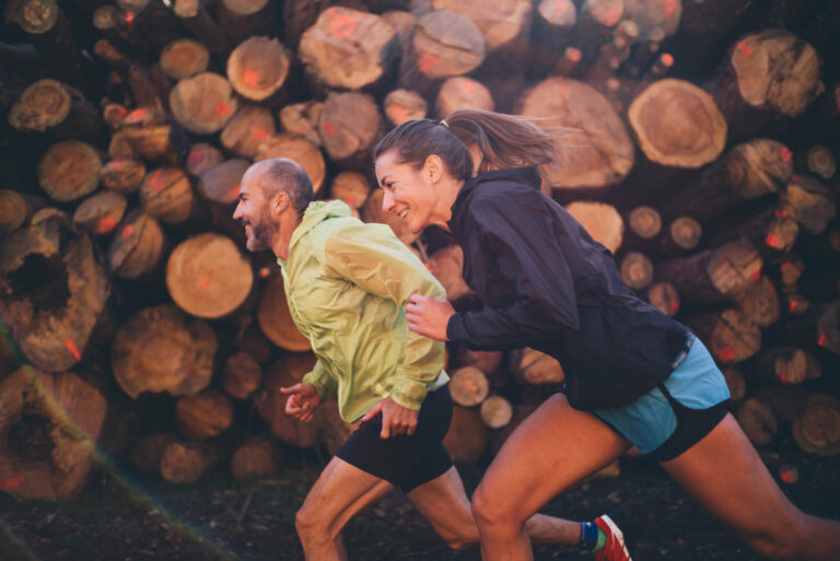 Man And Woman Running On The Mountain