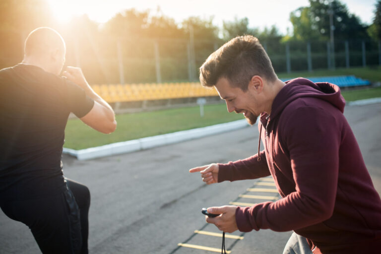 Morning Exercises With Personal Coach With Stopwatch