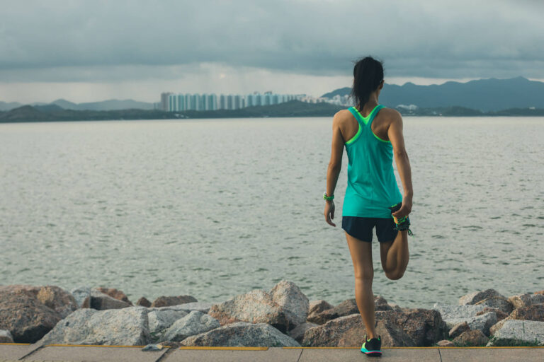 Healthy Lifestyle Woman Runner Stretching Legs Before Running