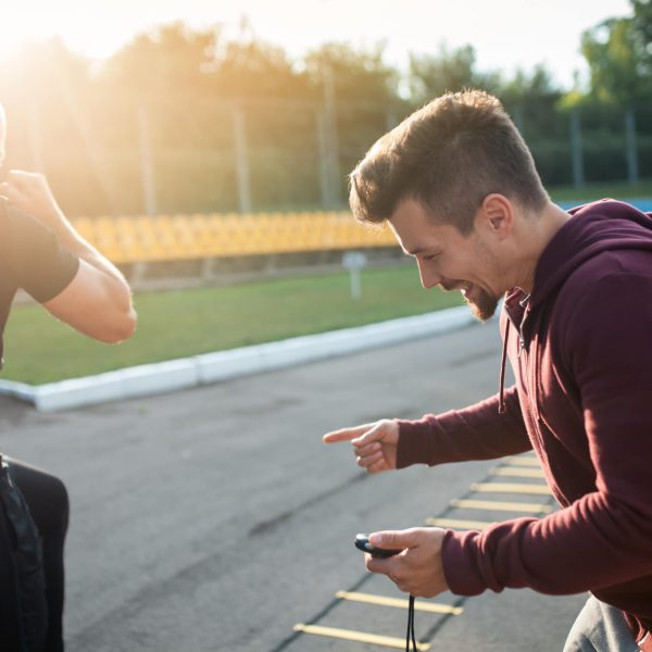Morning Exercises With Personal Coach With Stopwatch