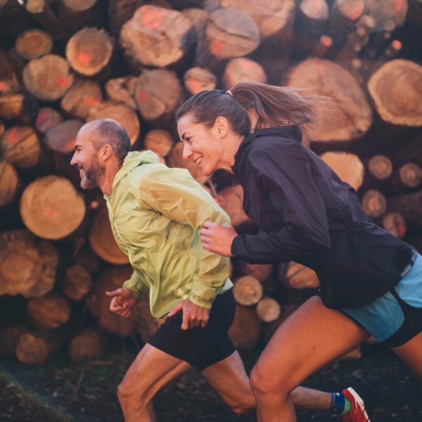 Man And Woman Running On The Mountain
